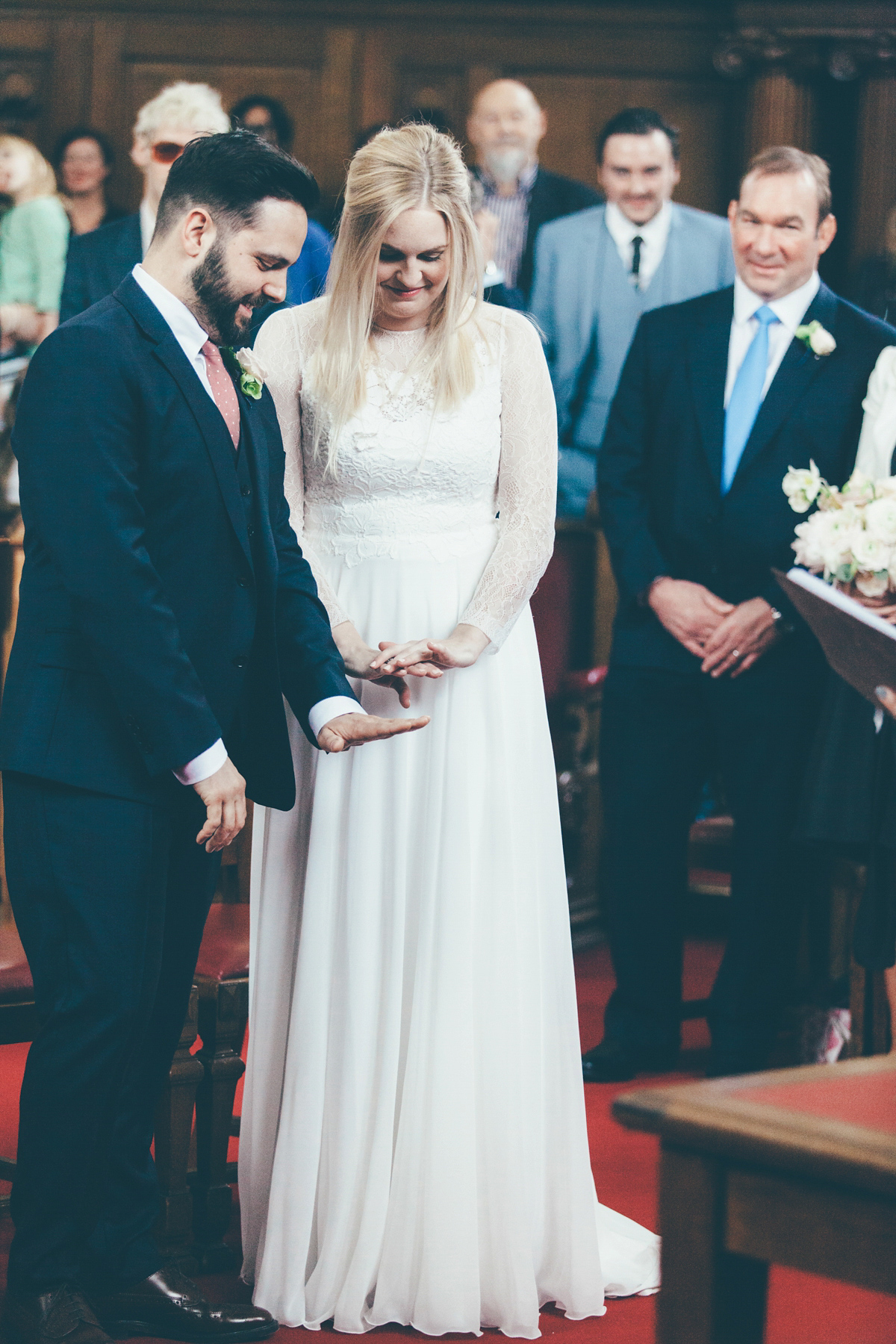 Ash wore a Jesus Peiro gown and winged shoes by Sophia Webster for her stripped back and fuss free wedding in London. Captured by September Pictures.