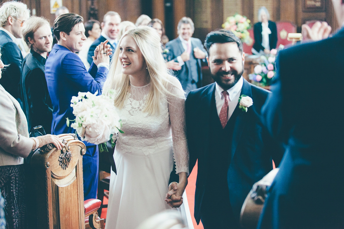 Ash wore a Jesus Peiro gown and winged shoes by Sophia Webster for her stripped back and fuss free wedding in London. Captured by September Pictures.