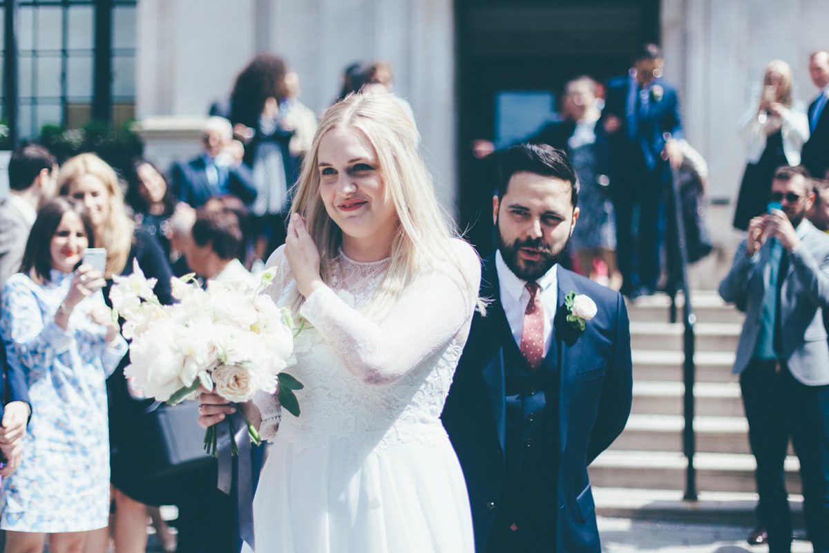 Ash wore a Jesus Peiro gown and winged shoes by Sophia Webster for her stripped back and fuss free wedding in London. Captured by September Pictures.