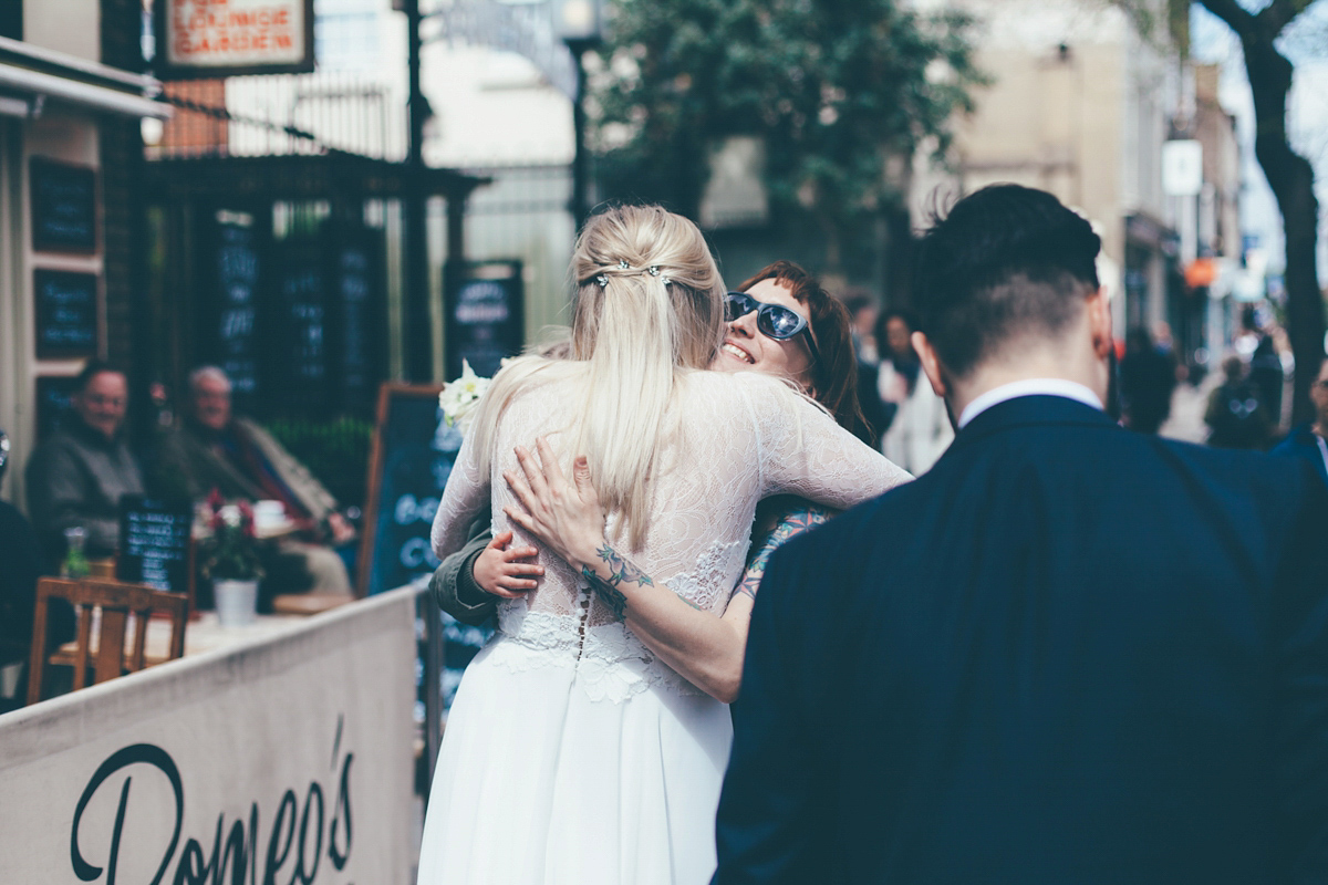 Ash wore a Jesus Peiro gown and winged shoes by Sophia Webster for her stripped back and fuss free wedding in London. Captured by September Pictures.