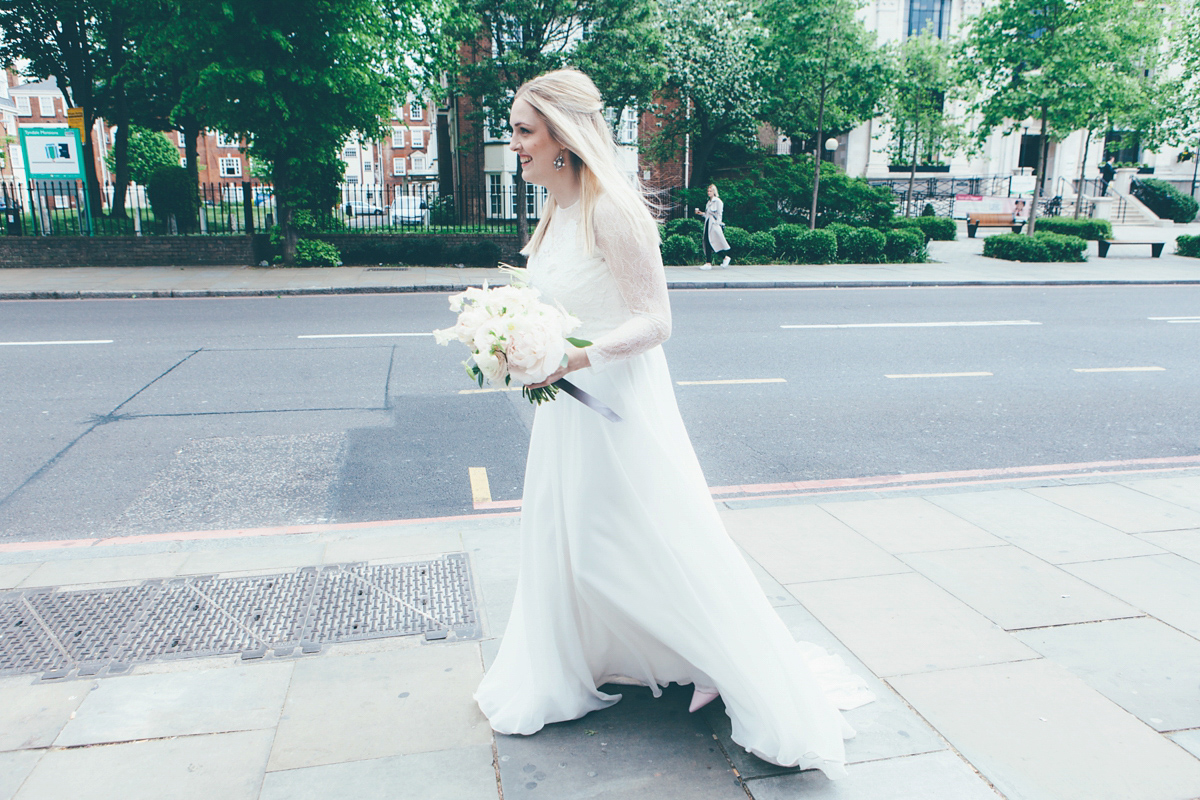 Ash wore a Jesus Peiro gown and winged shoes by Sophia Webster for her stripped back and fuss free wedding in London. Captured by September Pictures.