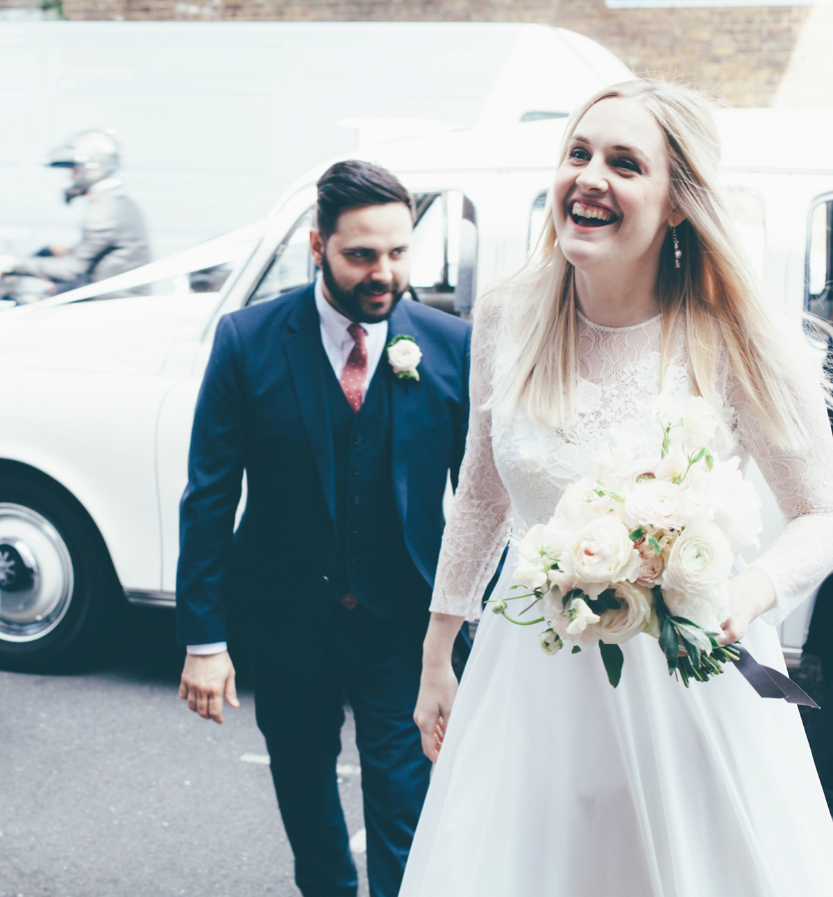 Ash wore a Jesus Peiro gown and winged shoes by Sophia Webster for her stripped back and fuss free wedding in London. Captured by September Pictures.