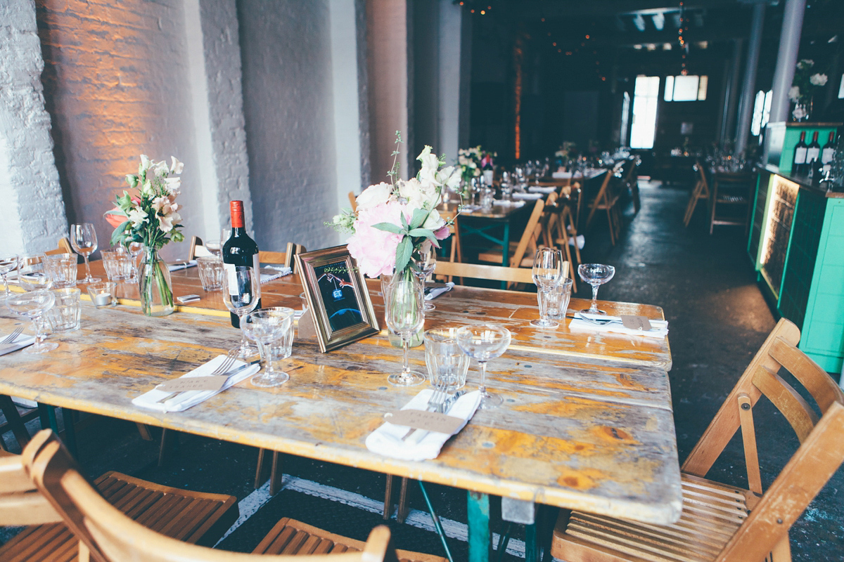 Ash wore a Jesus Peiro gown and winged shoes by Sophia Webster for her stripped back and fuss free wedding in London. Captured by September Pictures.