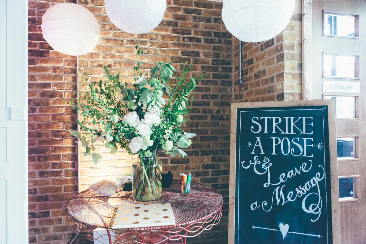 Ash wore a Jesus Peiro gown and winged shoes by Sophia Webster for her stripped back and fuss free wedding in London. Captured by September Pictures.