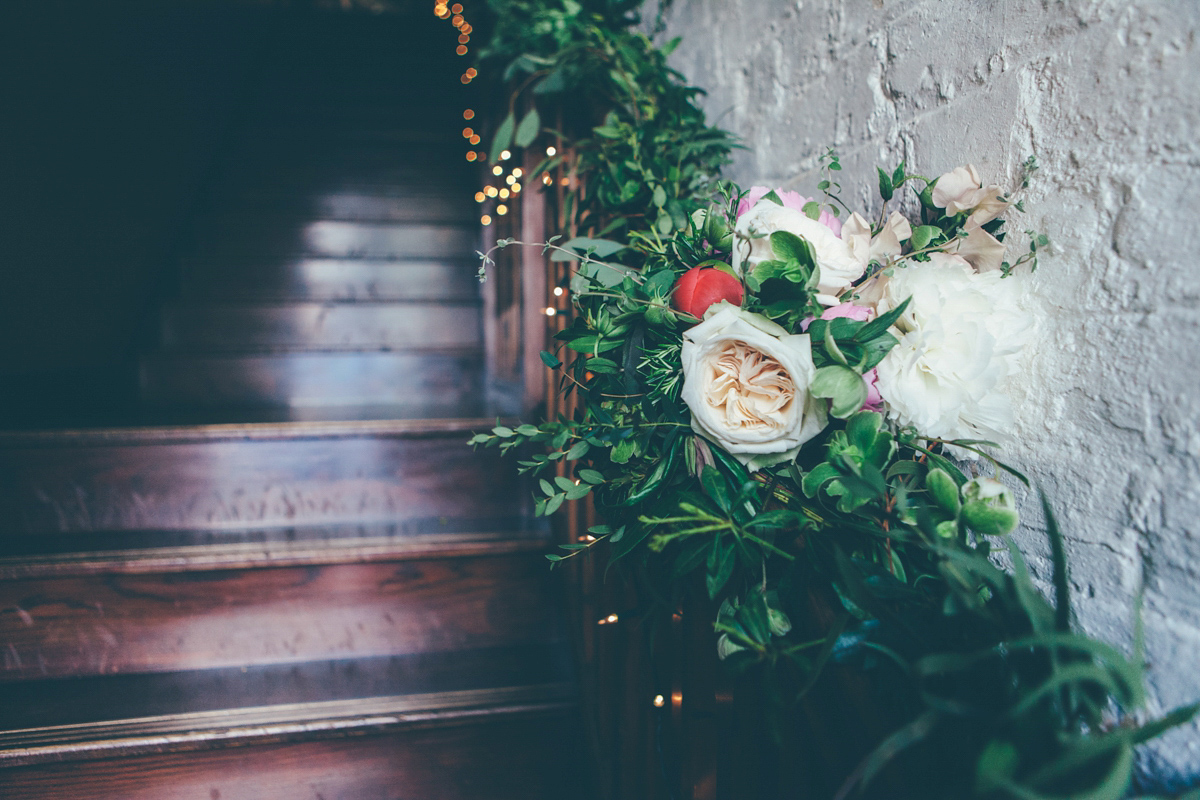 Ash wore a Jesus Peiro gown and winged shoes by Sophia Webster for her stripped back and fuss free wedding in London. Captured by September Pictures.