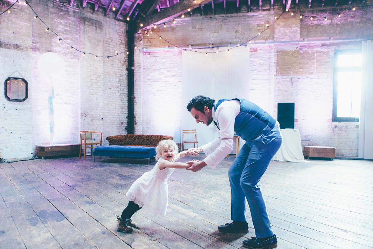 Ash wore a Jesus Peiro gown and winged shoes by Sophia Webster for her stripped back and fuss free wedding in London. Captured by September Pictures.