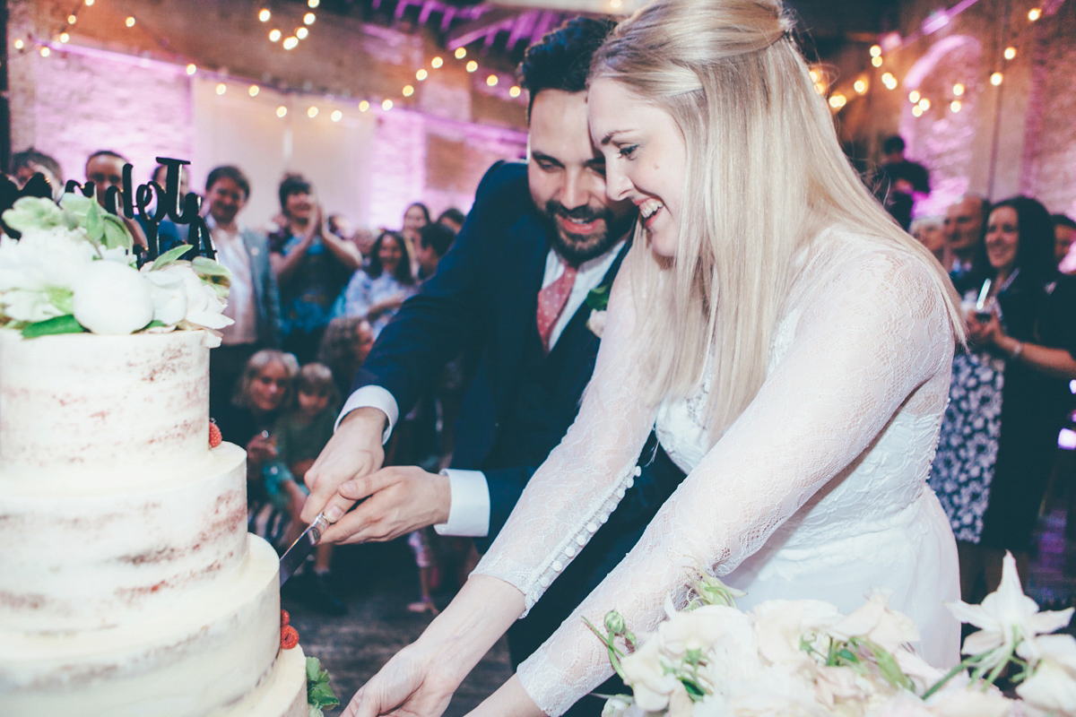 Ash wore a Jesus Peiro gown and winged shoes by Sophia Webster for her stripped back and fuss free wedding in London. Captured by September Pictures.