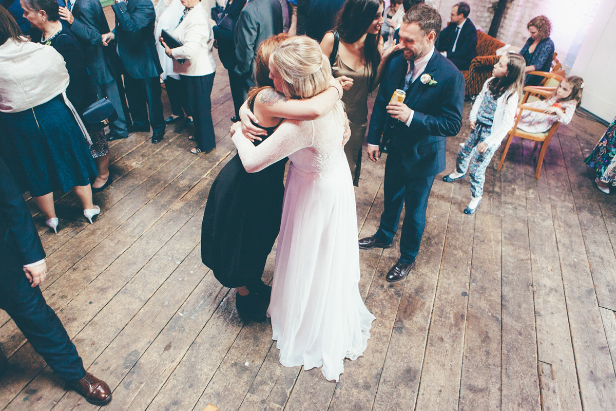 Ash wore a Jesus Peiro gown and winged shoes by Sophia Webster for her stripped back and fuss free wedding in London. Captured by September Pictures.