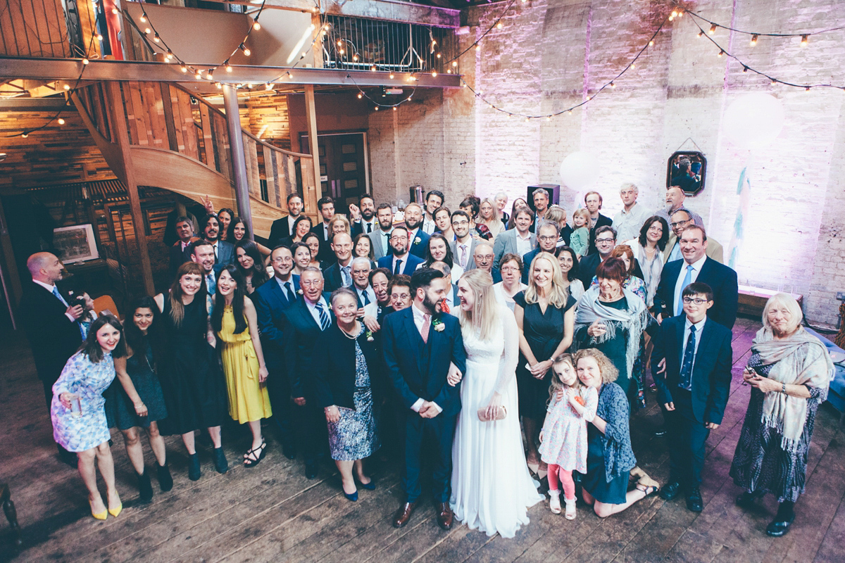 Ash wore a Jesus Peiro gown and winged shoes by Sophia Webster for her stripped back and fuss free wedding in London. Captured by September Pictures.