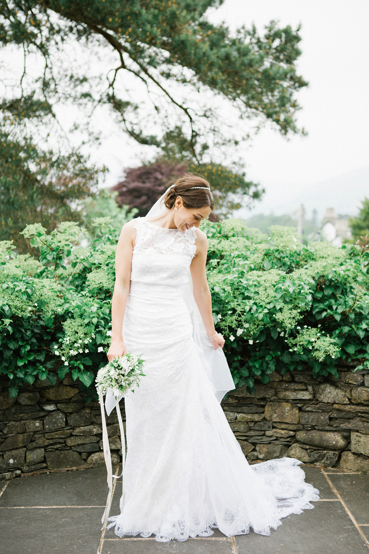 A Spring time wedding in the Lake District inspired by fairies. Bride Rachel wore a dress, veil and velvet shoes by Le Spose di Gio. Fine art wedding photography by Melissa Beattie.