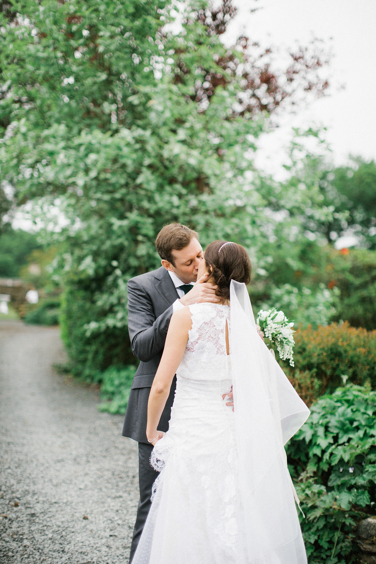 A Spring time wedding in the Lake District inspired by fairies. Bride Rachel wore a dress, veil and velvet shoes by Le Spose di Gio. Fine art wedding photography by Melissa Beattie.