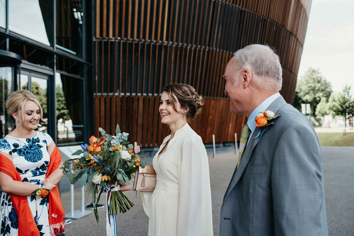 Jo wore the same dress her mother wore - a 1970's Ossie Clarke gown, for her colourful and modern wedding at the Royal Welsh College of Music. Photograhpy by Elaine Williams.