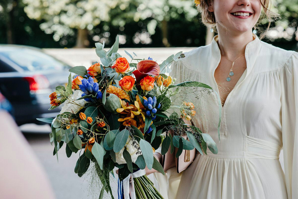 Jo wore the same dress her mother wore - a 1970's Ossie Clarke gown, for her colourful and modern wedding at the Royal Welsh College of Music. Photograhpy by Elaine Williams.