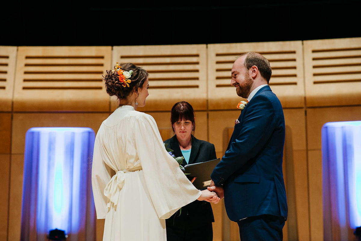 Jo wore the same dress her mother wore - a 1970's Ossie Clarke gown, for her colourful and modern wedding at the Royal Welsh College of Music. Photograhpy by Elaine Williams.