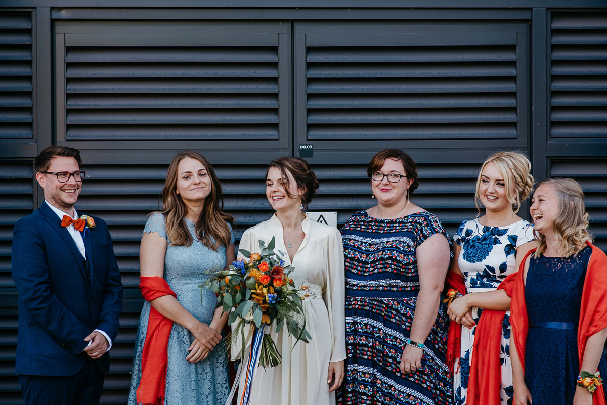 Jo wore the same dress her mother wore - a 1970's Ossie Clarke gown, for her colourful and modern wedding at the Royal Welsh College of Music. Photograhpy by Elaine Williams.