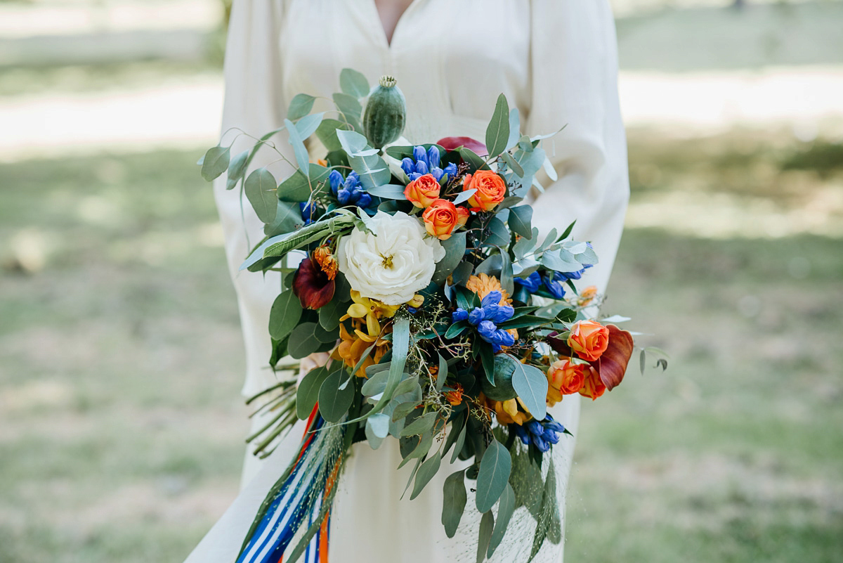 Jo wore the same dress her mother wore - a 1970's Ossie Clarke gown, for her colourful and modern wedding at the Royal Welsh College of Music. Photograhpy by Elaine Williams.