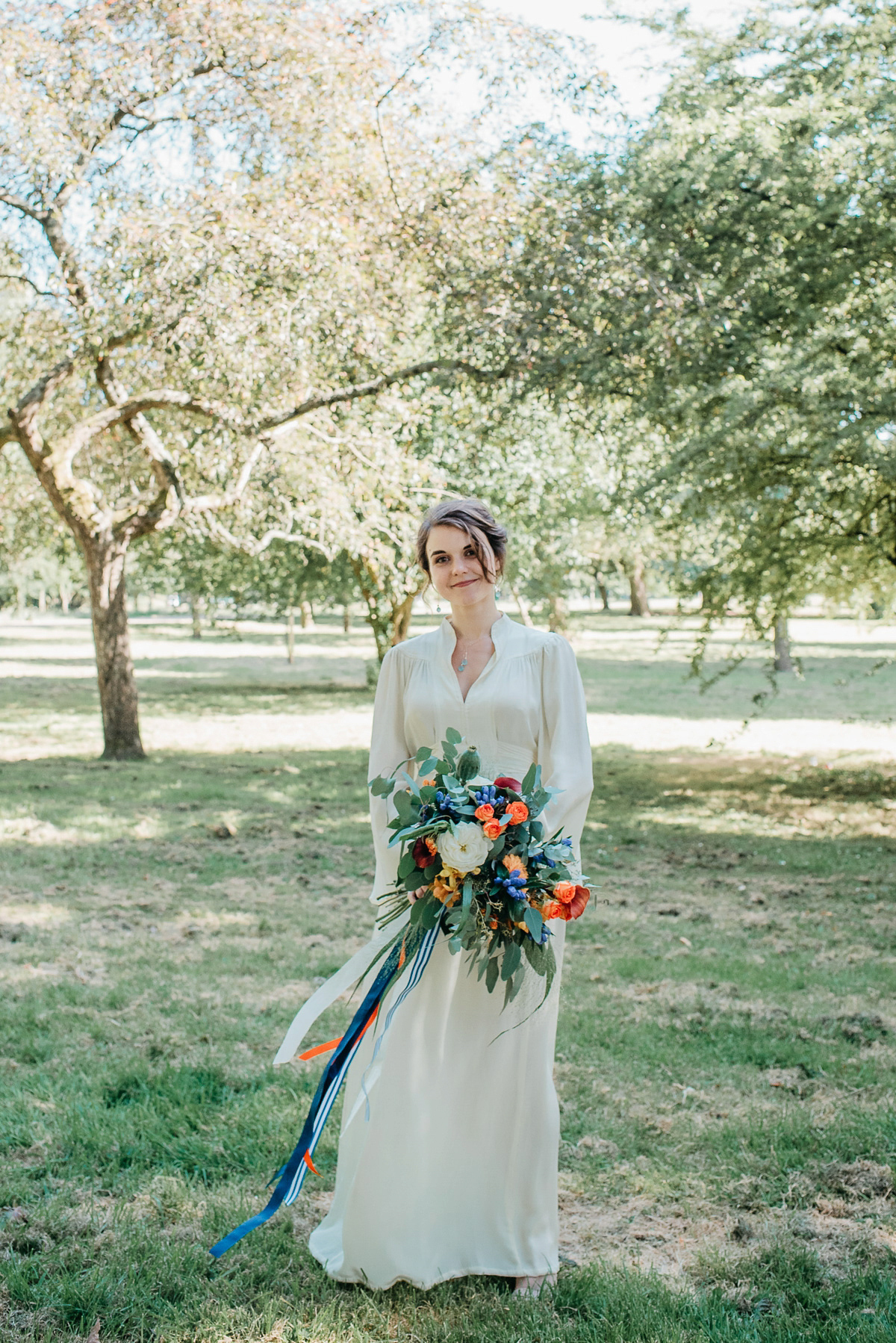 Jo wore the same dress her mother wore - a 1970's Ossie Clarke gown, for her colourful and modern wedding at the Royal Welsh College of Music. Photograhpy by Elaine Williams.