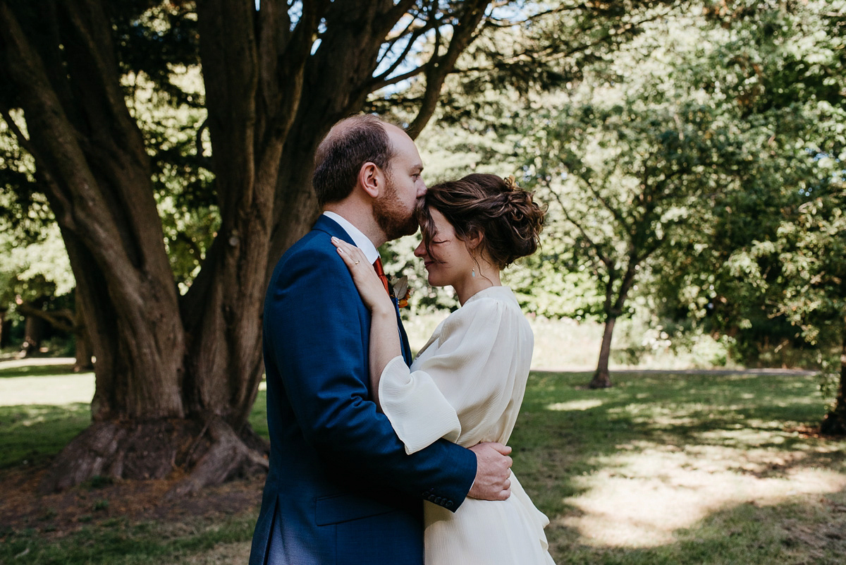 Jo wore the same dress her mother wore - a 1970's Ossie Clarke gown, for her colourful and modern wedding at the Royal Welsh College of Music. Photograhpy by Elaine Williams.