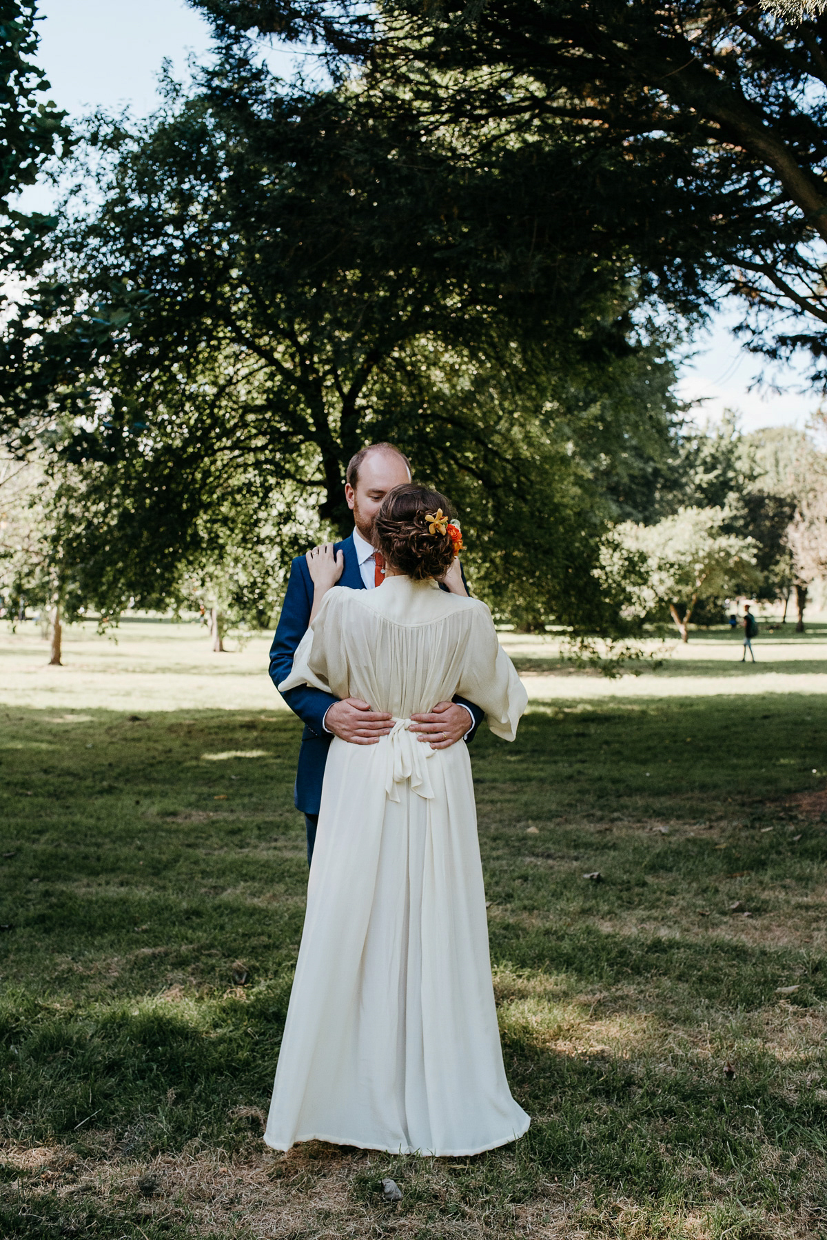 Jo wore the same dress her mother wore - a 1970's Ossie Clarke gown, for her colourful and modern wedding at the Royal Welsh College of Music. Photograhpy by Elaine Williams.