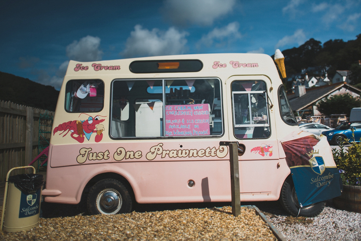 Rosie wore a Laure de Sagazan gown from The Mews of Notting Hill for her romantic summertime Devonshire coast wedding. Photography by Joseph Hall.