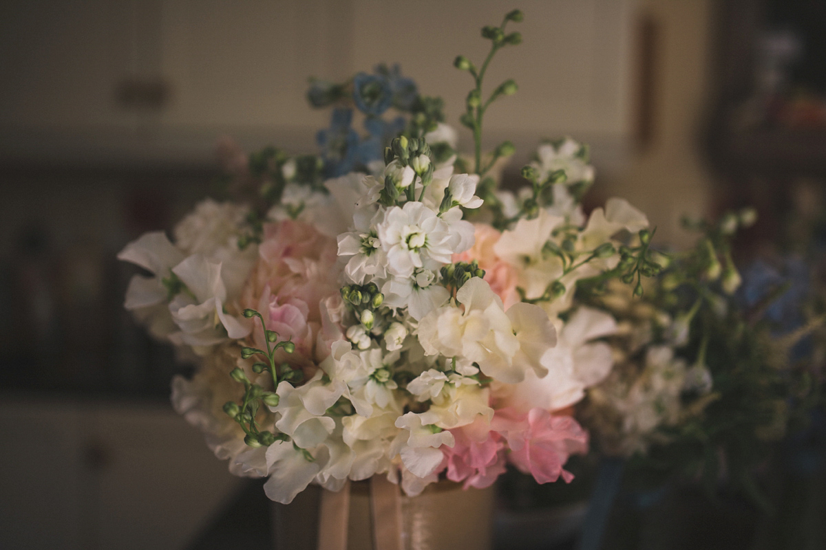 Rosie wore a Laure de Sagazan gown from The Mews of Notting Hill for her romantic summertime Devonshire coast wedding. Photography by Joseph Hall.