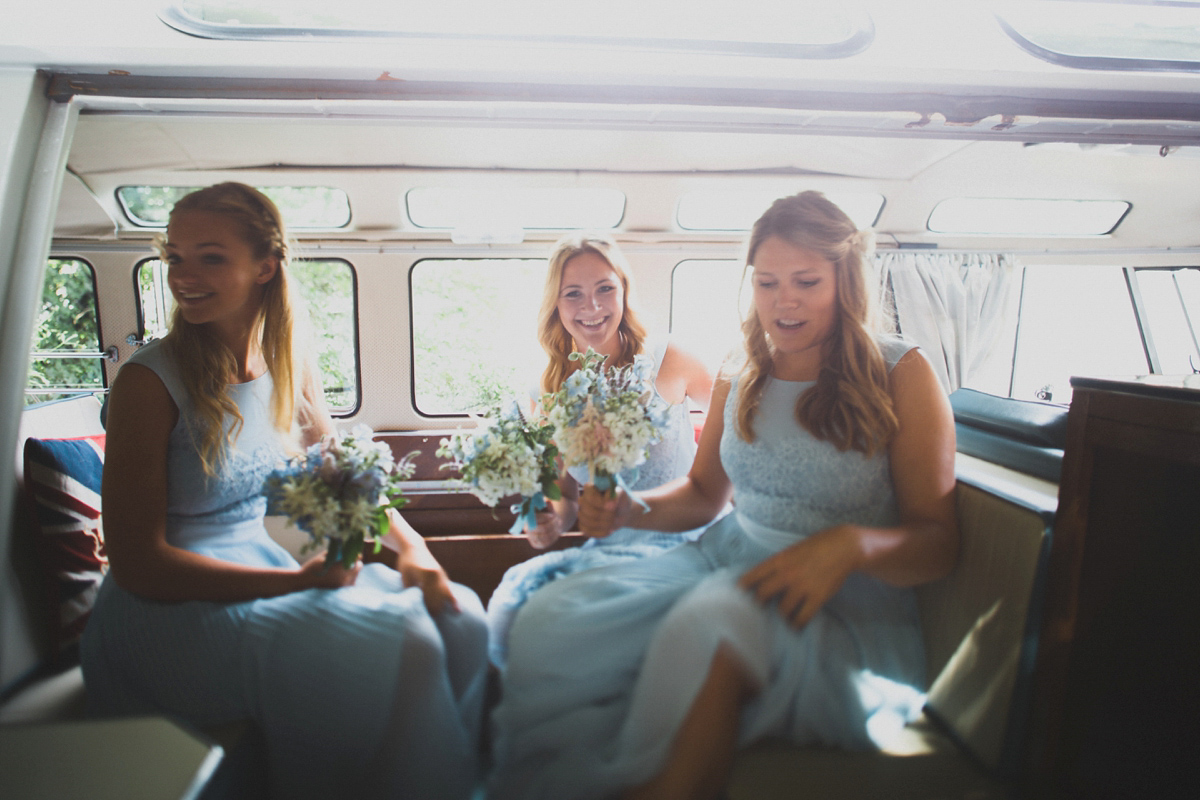 Rosie wore a Laure de Sagazan gown from The Mews of Notting Hill for her romantic summertime Devonshire coast wedding. Photography by Joseph Hall.