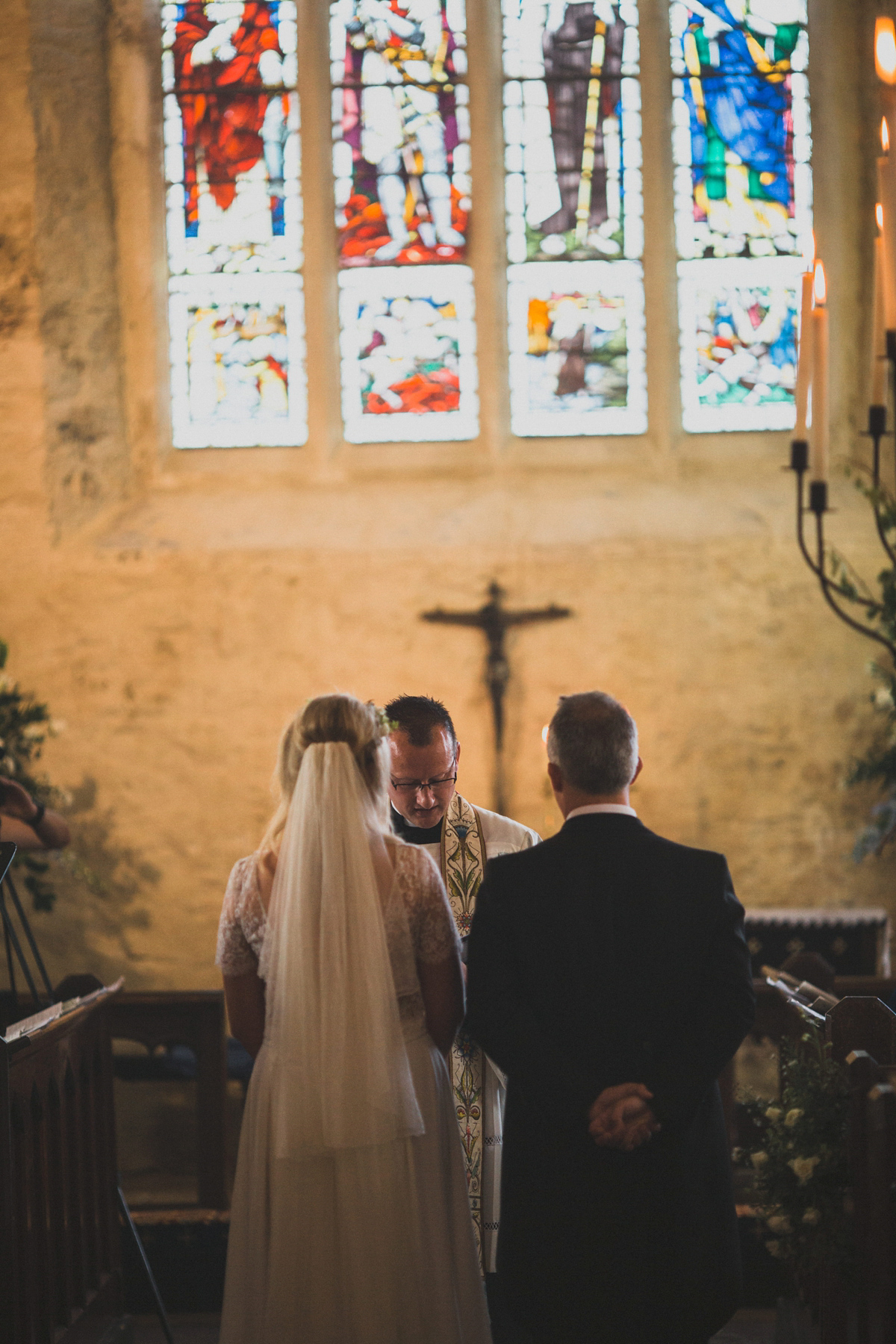 Rosie wore a Laure de Sagazan gown from The Mews of Notting Hill for her romantic summertime Devonshire coast wedding. Photography by Joseph Hall.