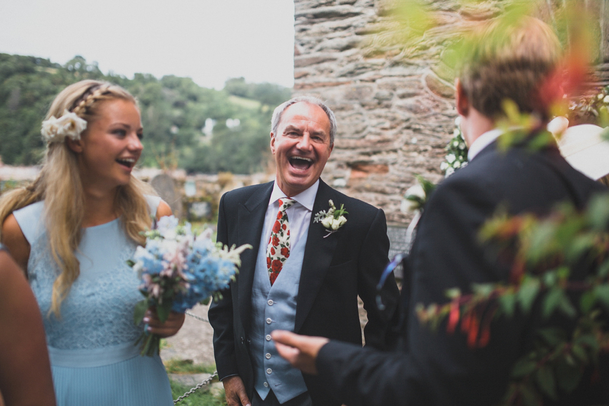 Rosie wore a Laure de Sagazan gown from The Mews of Notting Hill for her romantic summertime Devonshire coast wedding. Photography by Joseph Hall.