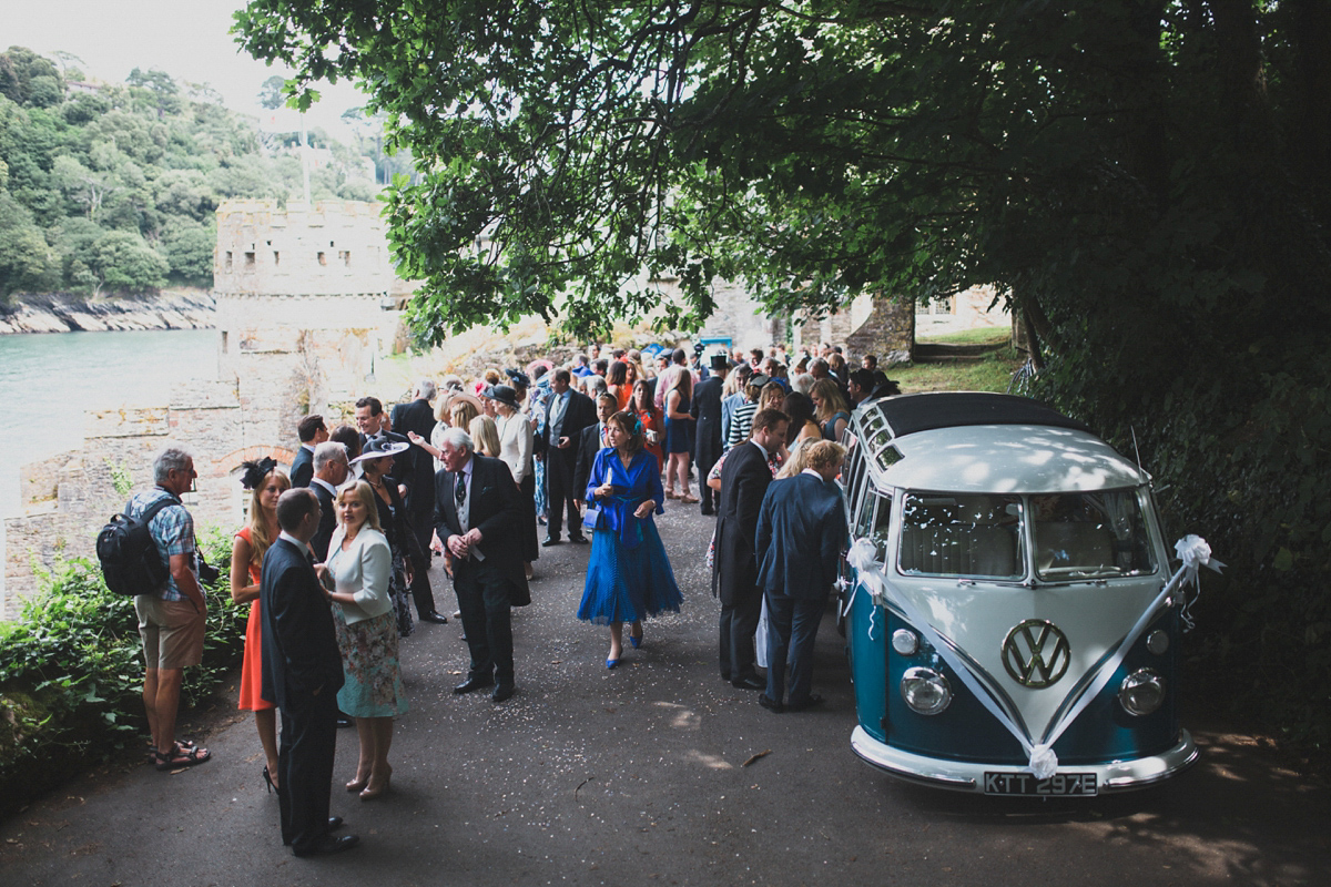 Rosie wore a Laure de Sagazan gown from The Mews of Notting Hill for her romantic summertime Devonshire coast wedding. Photography by Joseph Hall.