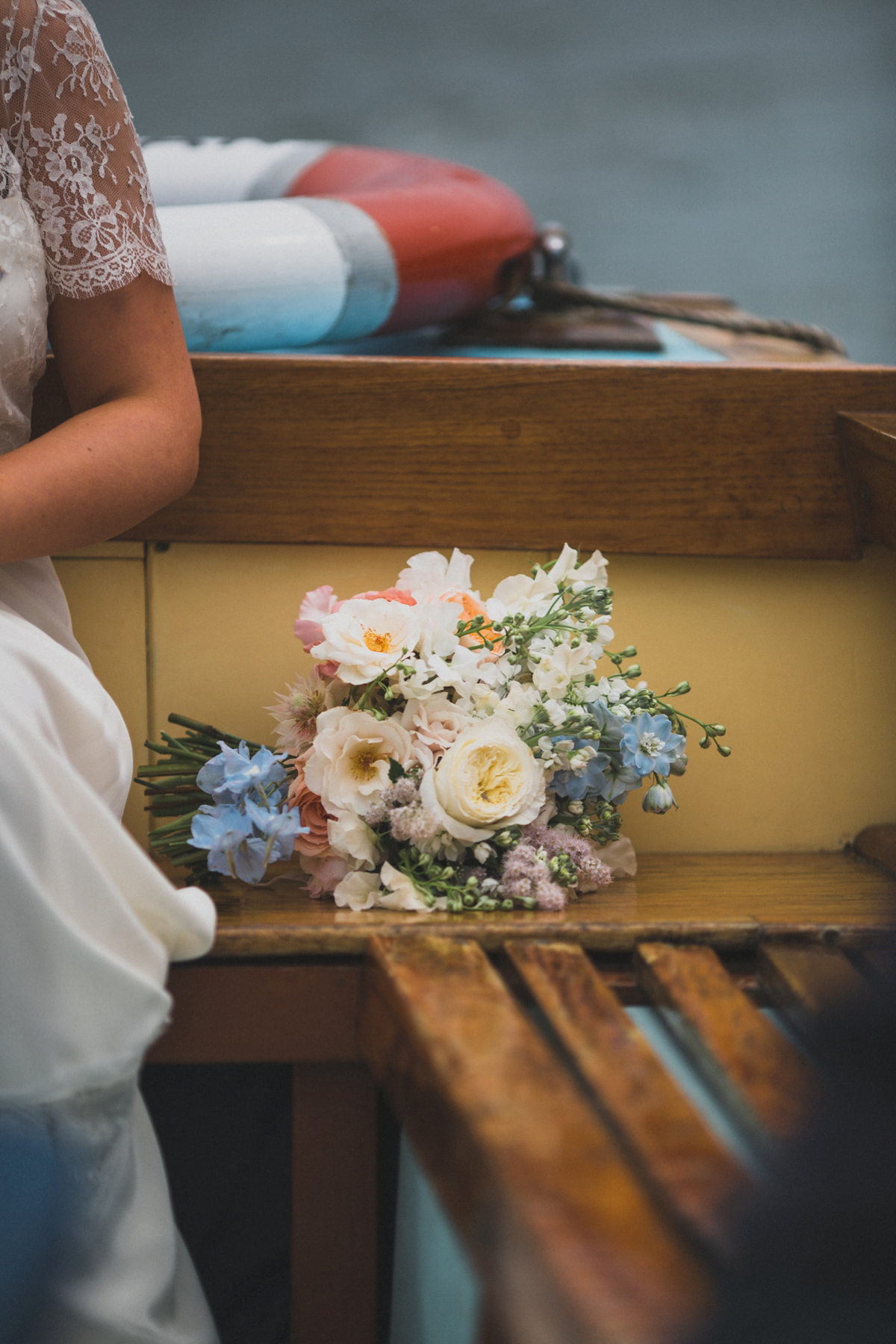 Rosie wore a Laure de Sagazan gown from The Mews of Notting Hill for her romantic summertime Devonshire coast wedding. Photography by Joseph Hall.