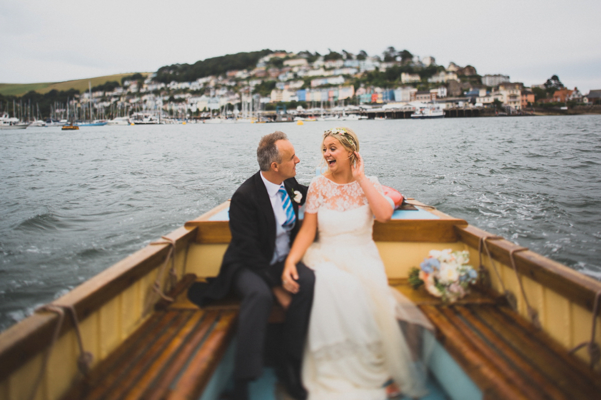 Rosie wore a Laure de Sagazan gown from The Mews of Notting Hill for her romantic summertime Devonshire coast wedding. Photography by Joseph Hall.