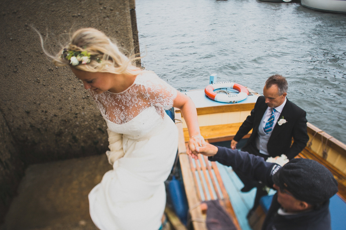 Rosie wore a Laure de Sagazan gown from The Mews of Notting Hill for her romantic summertime Devonshire coast wedding. Photography by Joseph Hall.