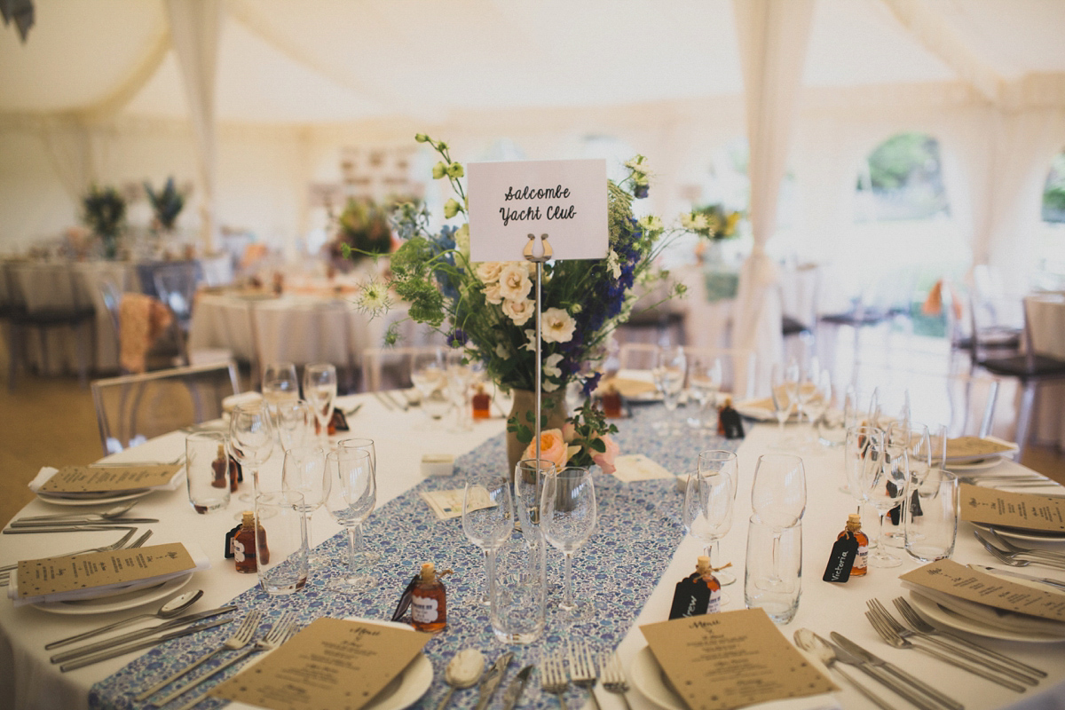 Rosie wore a Laure de Sagazan gown from The Mews of Notting Hill for her romantic summertime Devonshire coast wedding. Photography by Joseph Hall.