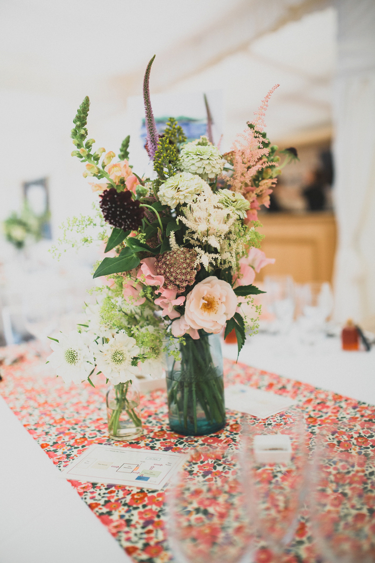 Rosie wore a Laure de Sagazan gown from The Mews of Notting Hill for her romantic summertime Devonshire coast wedding. Photography by Joseph Hall.