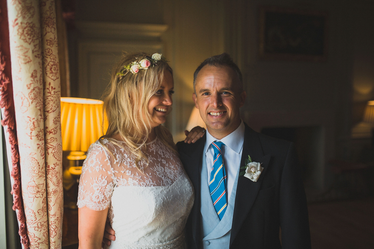 Rosie wore a Laure de Sagazan gown from The Mews of Notting Hill for her romantic summertime Devonshire coast wedding. Photography by Joseph Hall.