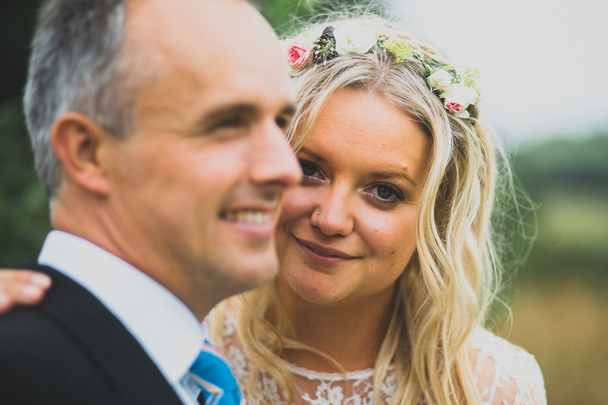 Rosie wore a Laure de Sagazan gown from The Mews of Notting Hill for her romantic summertime Devonshire coast wedding. Photography by Joseph Hall.