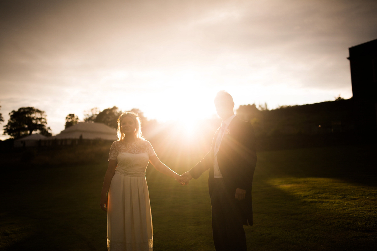 Rosie wore a Laure de Sagazan gown from The Mews of Notting Hill for her romantic summertime Devonshire coast wedding. Photography by Joseph Hall.