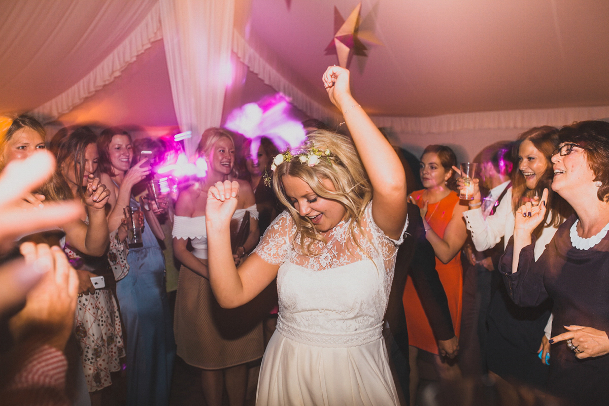 Rosie wore a Laure de Sagazan gown from The Mews of Notting Hill for her romantic summertime Devonshire coast wedding. Photography by Joseph Hall.