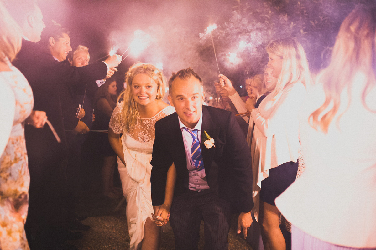 Rosie wore a Laure de Sagazan gown from The Mews of Notting Hill for her romantic summertime Devonshire coast wedding. Photography by Joseph Hall.