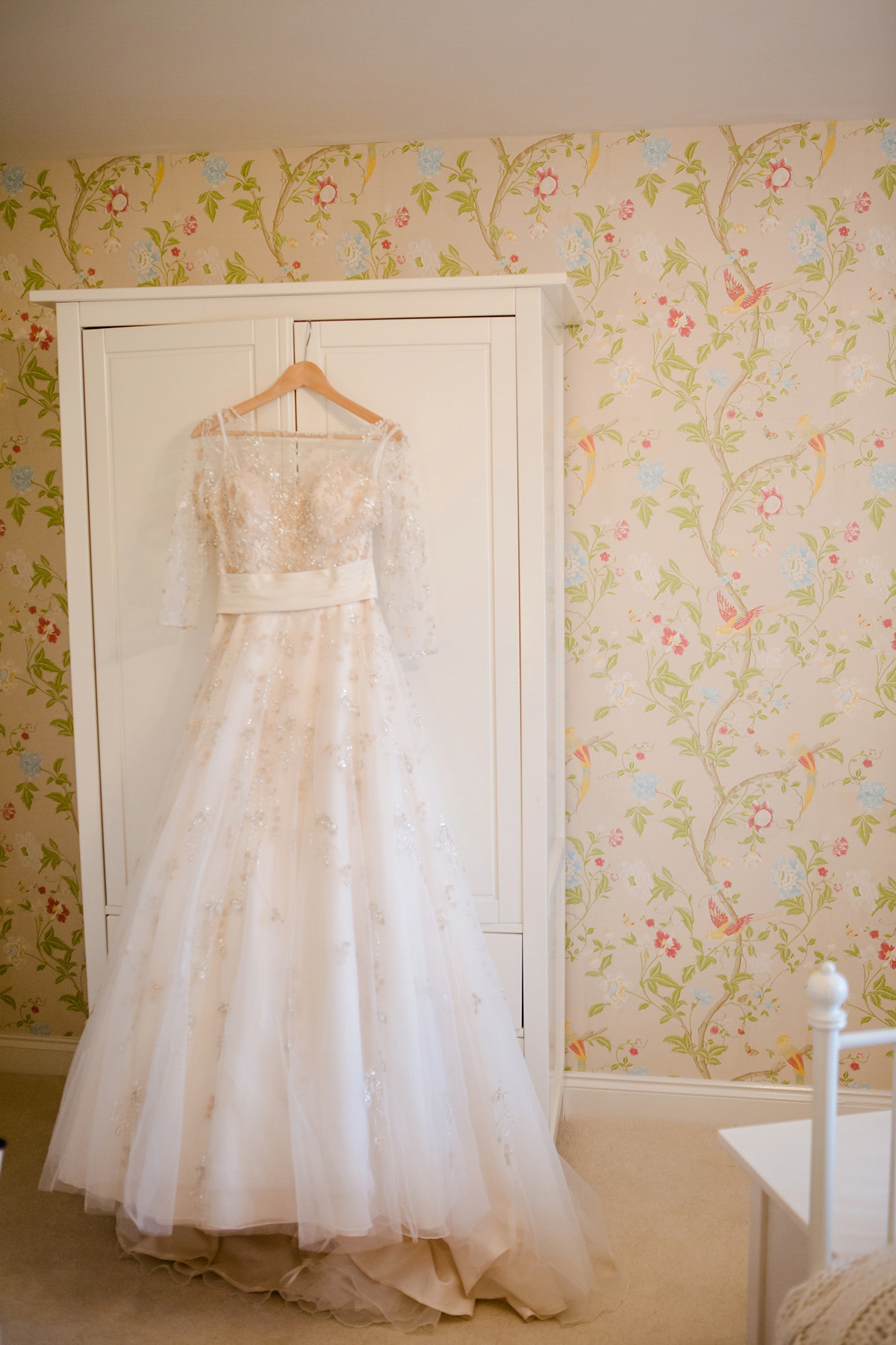 Katy wore a gold embroidered gown by Ronald Joyce for her glamorous winter wedding at Bath Assembly Rooms. Her bridesmaids wore navy blue. Photography by Lydia Stamps.