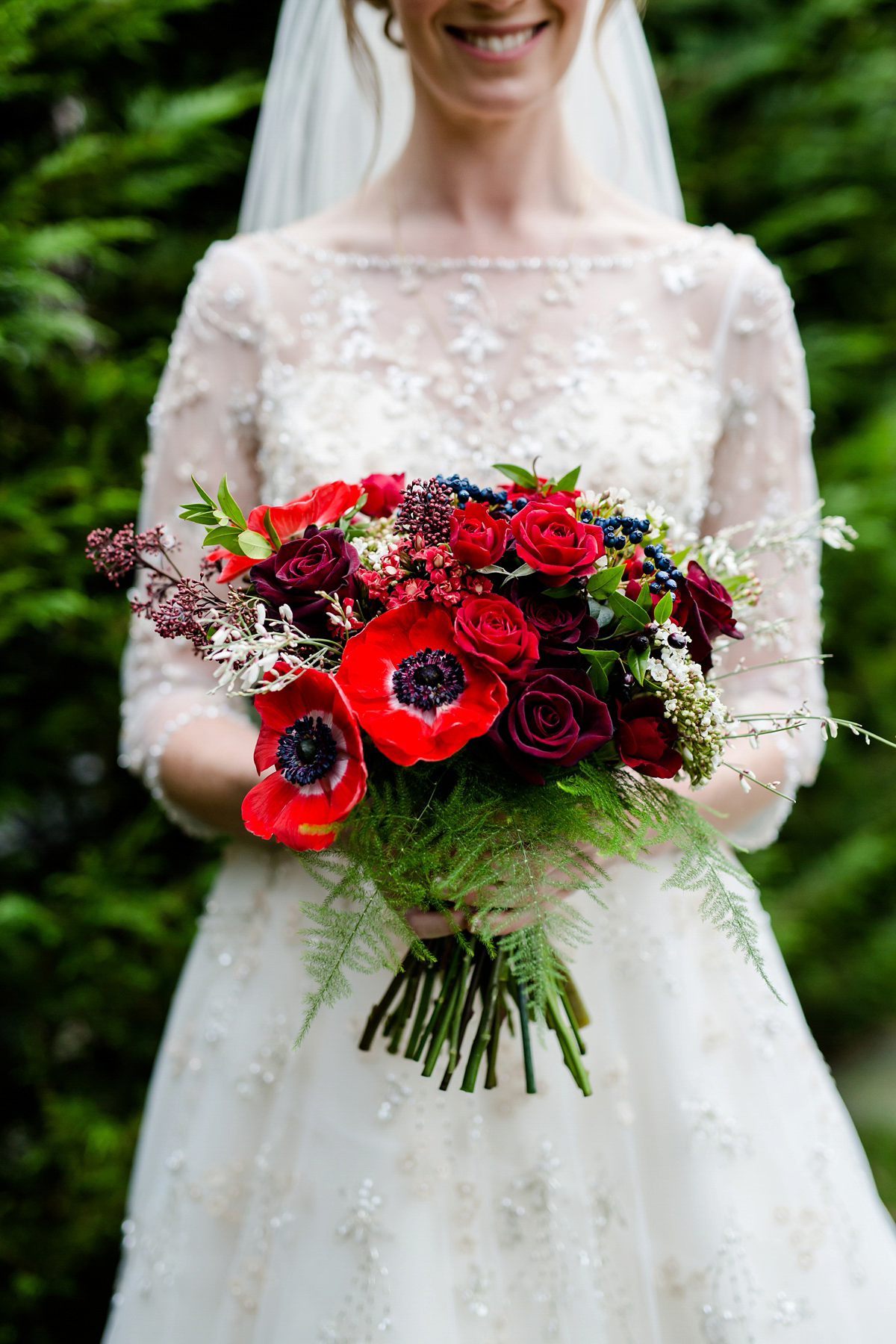 Katy wore a gold embroidered gown by Ronald Joyce for her glamorous winter wedding at Bath Assembly Rooms. Her bridesmaids wore navy blue. Photography by Lydia Stamps.