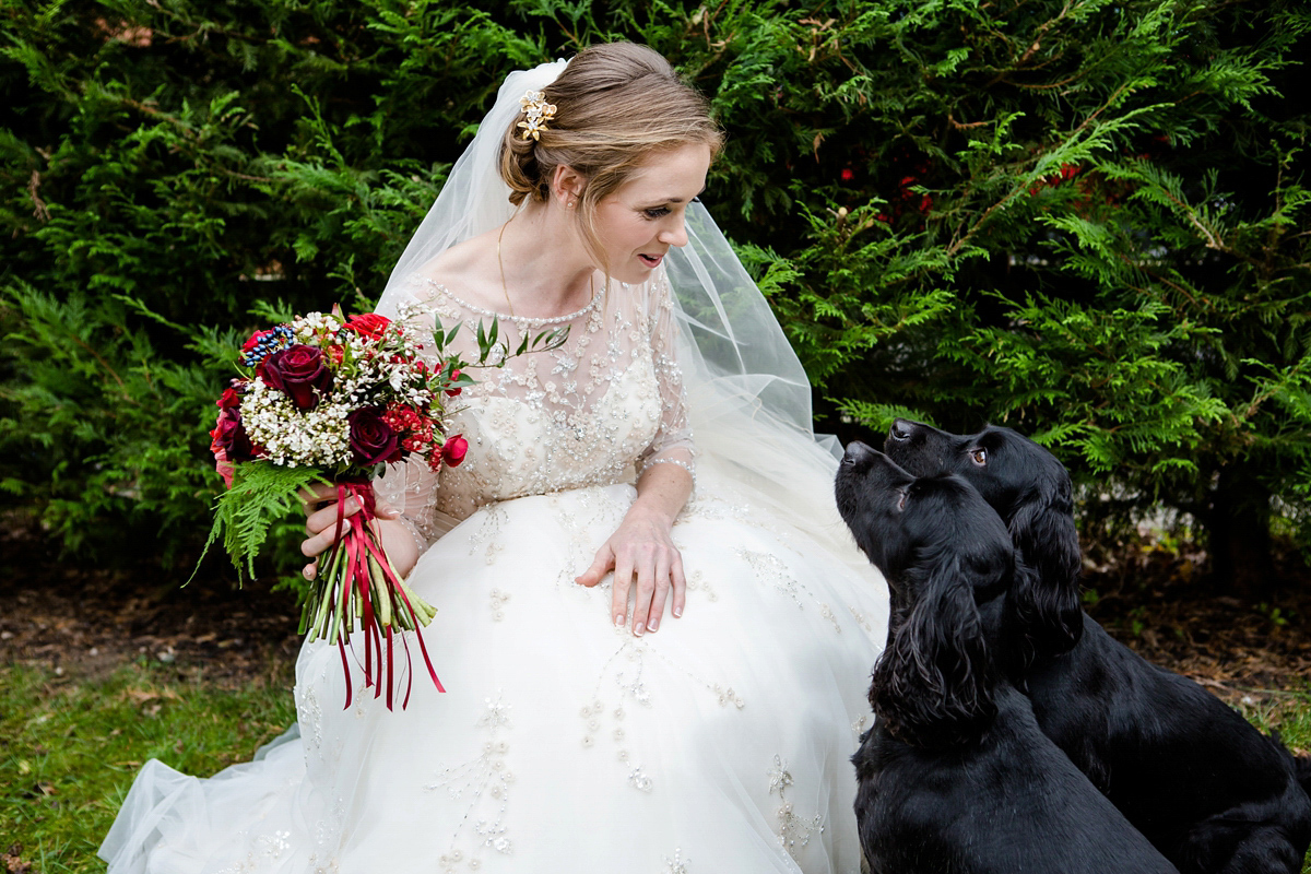 Katy wore a gold embroidered gown by Ronald Joyce for her glamorous winter wedding at Bath Assembly Rooms. Her bridesmaids wore navy blue. Photography by Lydia Stamps.