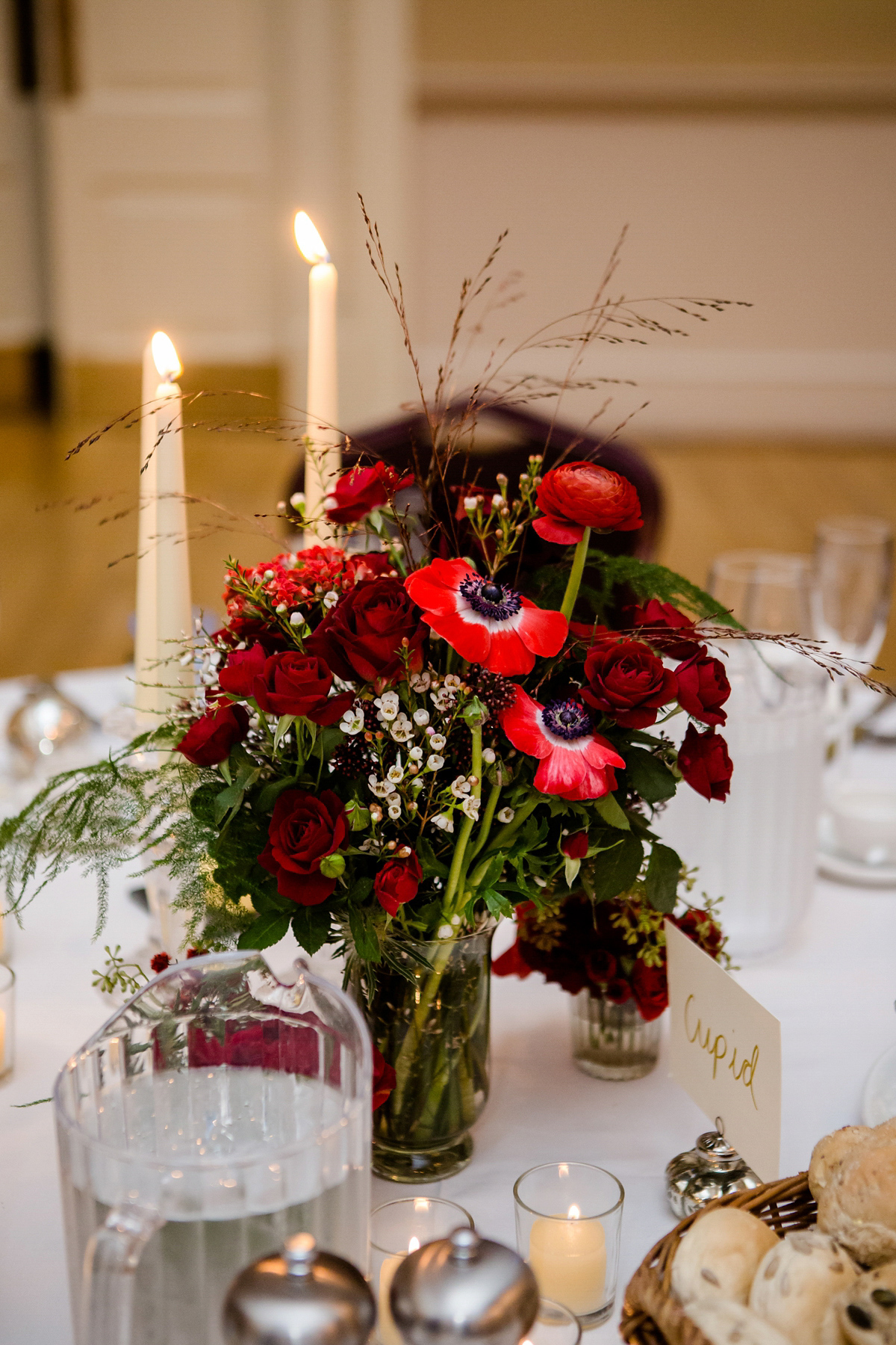 Katy wore a gold embroidered gown by Ronald Joyce for her glamorous winter wedding at Bath Assembly Rooms. Her bridesmaids wore navy blue. Photography by Lydia Stamps.