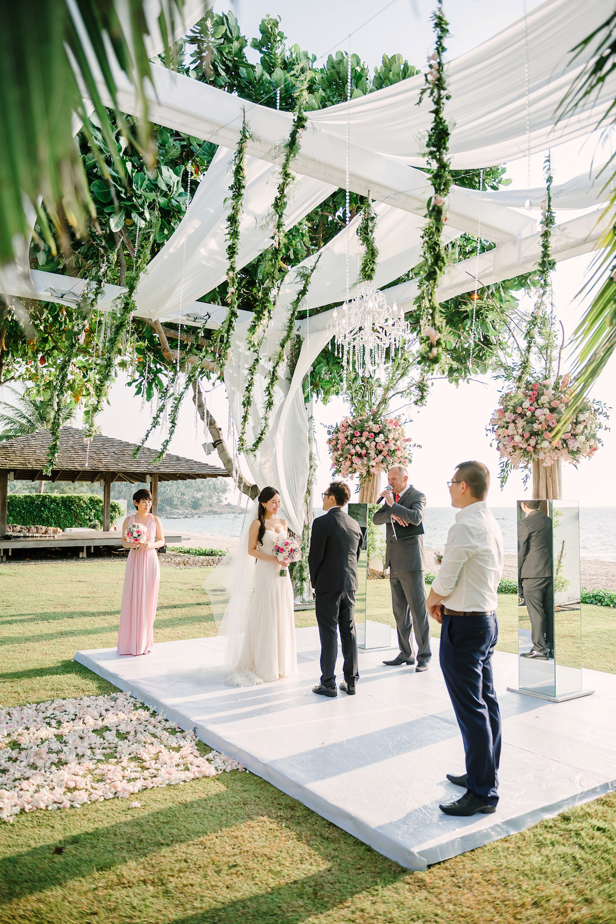 Hong Kiu wore a Jenny Yoo gown and BHLDN tulle skirt for her romantic and elegant wedding in Thailand. The day was planned by 'The Wedding Bliss Thailand'.
