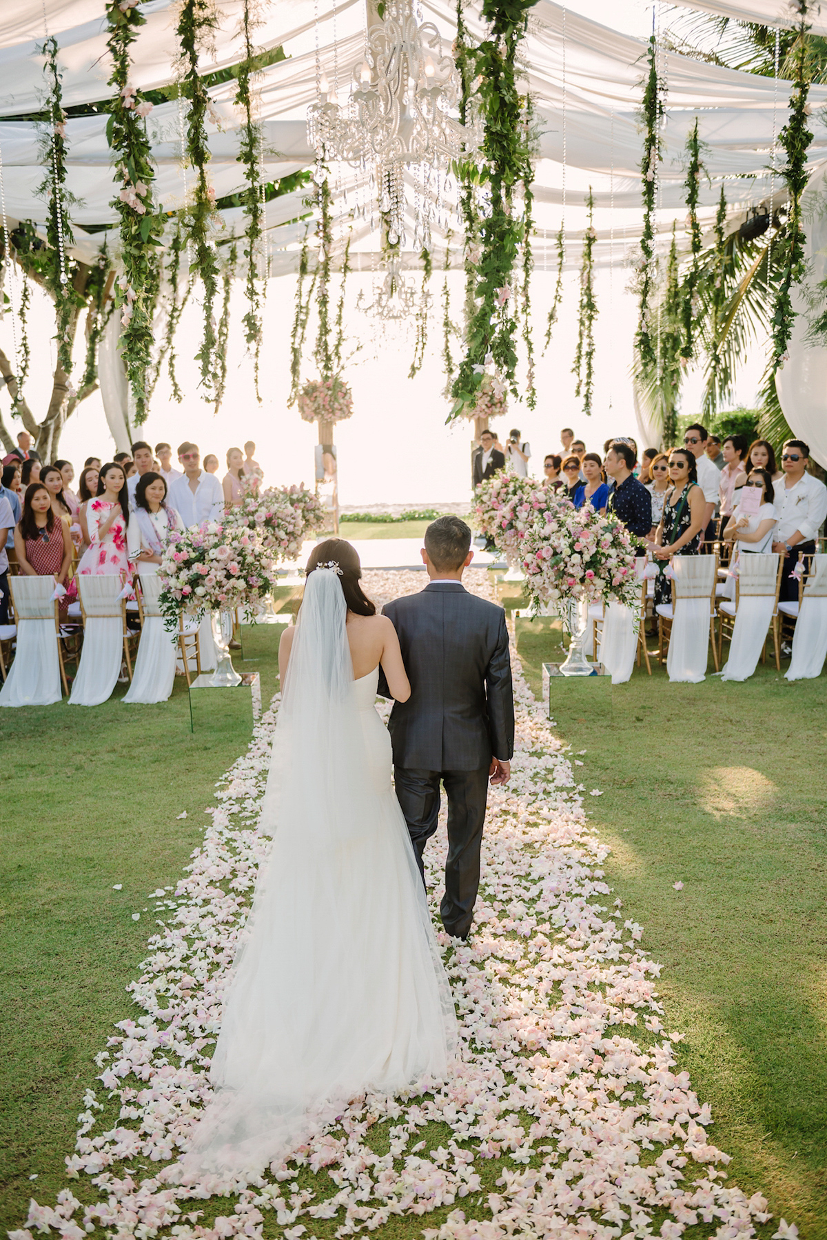 Hong Kiu wore a Jenny Yoo gown and BHLDN tulle skirt for her romantic and elegant wedding in Thailand. The day was planned by 'The Wedding Bliss Thailand'.