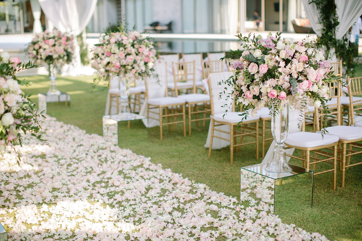 Hong Kiu wore a Jenny Yoo gown and BHLDN tulle skirt for her romantic and elegant wedding in Thailand. The day was planned by 'The Wedding Bliss Thailand'.