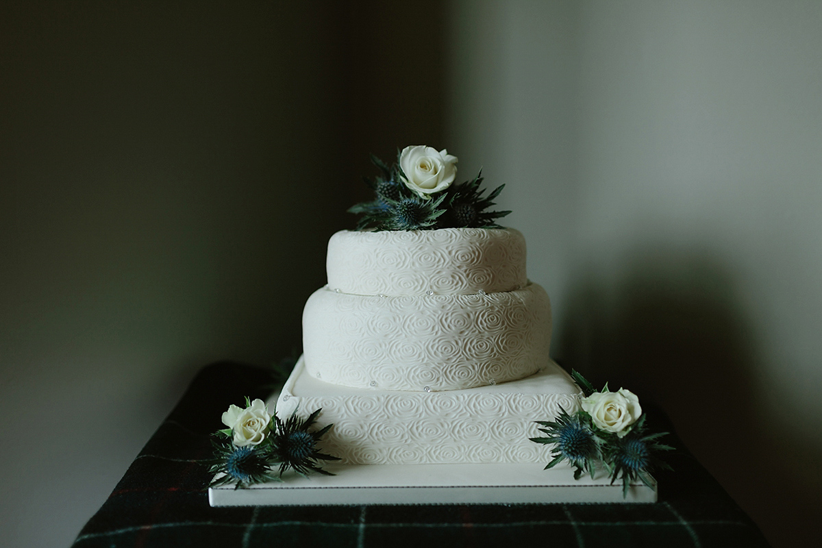 Berenice wore a 1930's vintage wedding dress for her intimate wedding held at home. The couple's ceremony involved a traditional Celtic handfasting. Photography by Rooftop Mosaic.