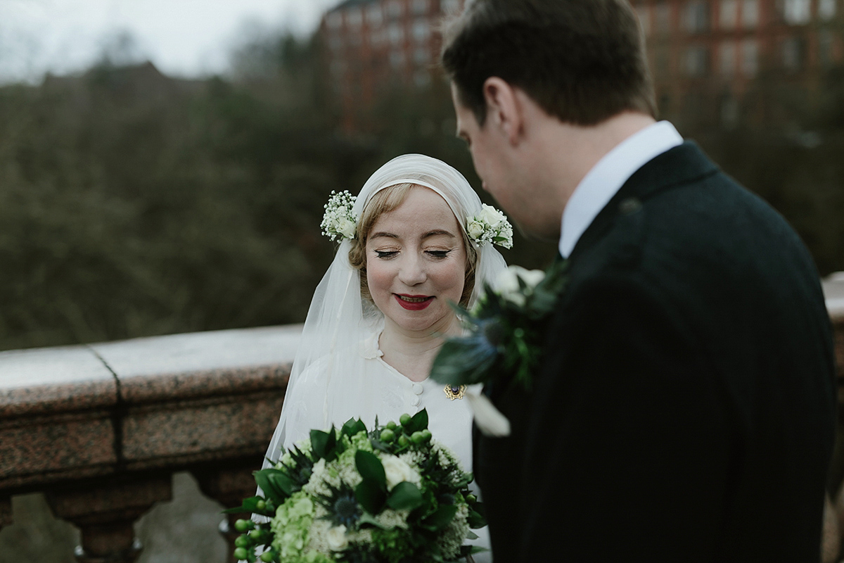 Berenice wore a 1930's vintage wedding dress for her intimate wedding held at home. The couple's ceremony involved a traditional Celtic handfasting. Photography by Rooftop Mosaic.