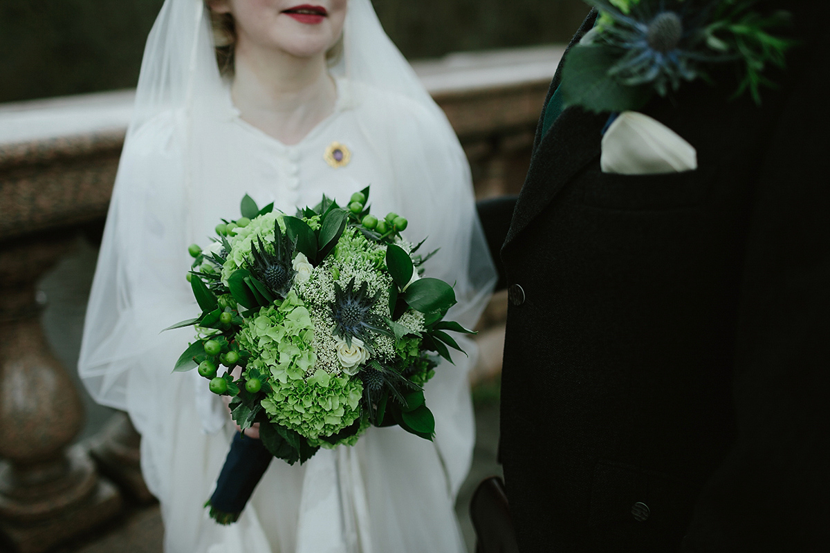 Berenice wore a 1930's vintage wedding dress for her intimate wedding held at home. The couple's ceremony involved a traditional Celtic handfasting. Photography by Rooftop Mosaic.