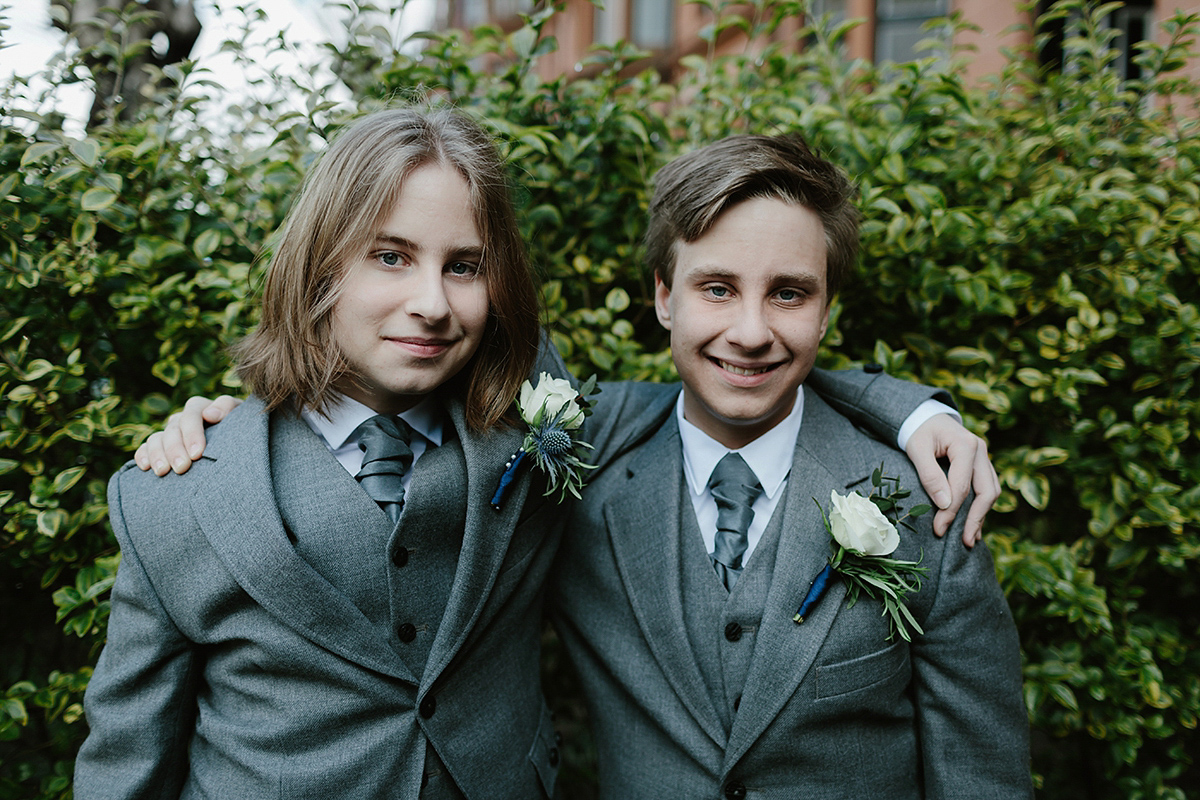 Berenice wore a 1930's vintage wedding dress for her intimate wedding held at home. The couple's ceremony involved a traditional Celtic handfasting. Photography by Rooftop Mosaic.